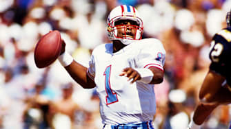 Houston Oilers quarterback Warren Moon (1) in action against the San Diego Chargers at Jack Murphy Stadium on Sept. 19, 1993. Moon's 1985 Topps Football rookie card recently fetched a record price at auction. 