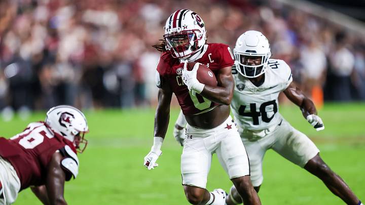 Sep 21, 2024; Columbia, South Carolina, USA; South Carolina Gamecocks running back Juju McDowell (0) rushes against the Akron Zips in the second quarter at Williams-Brice Stadium. Mandatory Credit: Jeff Blake-Imagn Images