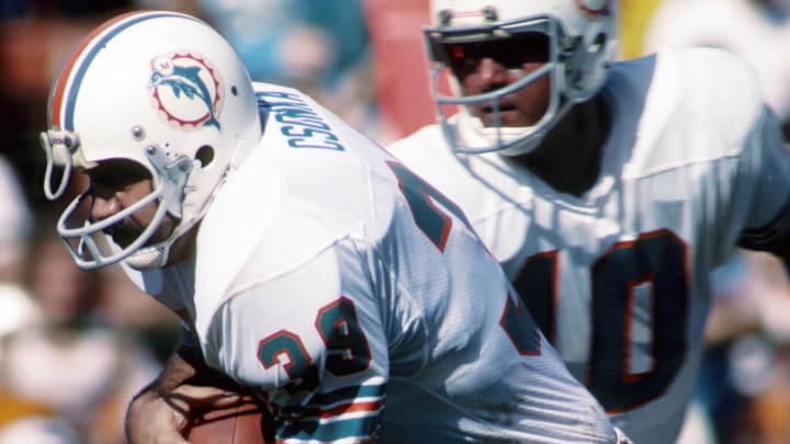 Miami Dolphins running back Larry Csonka carries the ball against the New York Jets at the Orange Bowl in 1979.