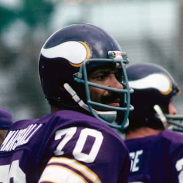 Jim Marshall looks on during a game against the Dolphins in 1976.