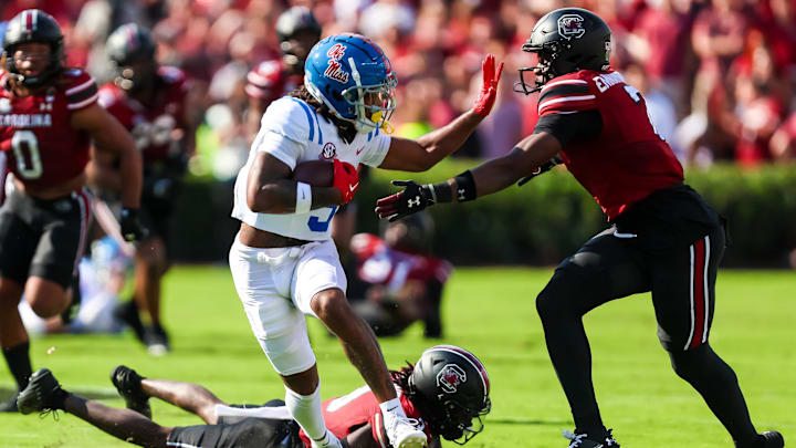 Oct 5, 2024; Columbia, South Carolina, USA; Mississippi Rebels wide receiver Antwane Wells Jr. (3) attempts to stiff arm South Carolina Gamecocks defensive back Nick Emmanwori (7) in the first quarter at Williams-Brice Stadium. Mandatory Credit: Jeff Blake-Imagn Images