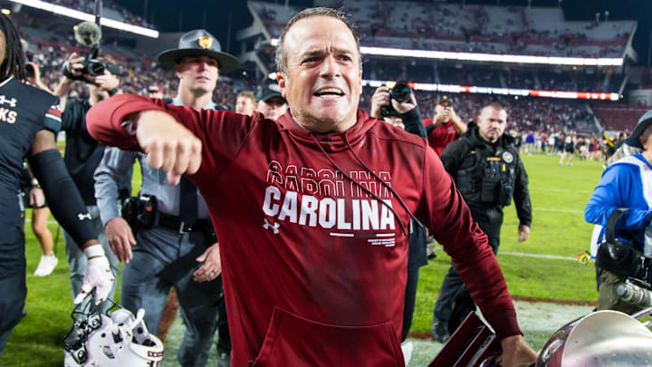 Nov 16, 2024; Columbia, South Carolina, USA; South Carolina Gamecocks head coach Shane Beamer celebrates beating the Missouri Tigers at Williams-Brice Stadium. He is holding the Mayors Cup, given to the winner of the South Carolina-Missouri game. Mandatory Credit: Jeff Blake-Imagn Images