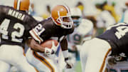Oct 8, 1989; Miami, FL, USA; FILE PHOTO; Cleveland Browns kick returner Eric Metcalf (21) carries the ball against the Miami Dolphins at Joe Robbie Stadium during the 1989 season. Mandatory Credit: RVR Photos-Imagn Images