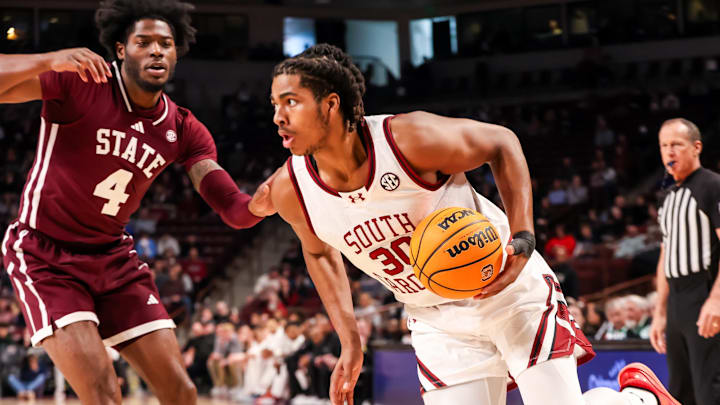 Jan 25, 2025; Columbia, South Carolina, USA; South Carolina Gamecocks forward Collin Murray-Boyles (30) drives past Mississippi State Bulldogs forward Cameron Matthews (4) in the first half at Colonial Life Arena. Mandatory Credit: Jeff Blake-Imagn Images