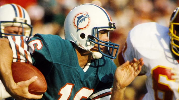 Miami Dolphins quarterback David Woodley (16) runs with the ball against the Washington Redskins during Super Bowl XVII at the Rose Bowl.