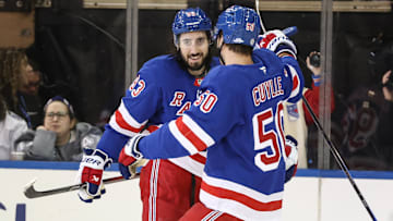 Apr 17, 2025; New York, New York, USA;  New York Rangers center Mika Zibanejad (93) celebrates with left wing Will Cuylle (50) after scoring a goal in the third period against the Tampa Bay Lightning at Madison Square Garden. Mandatory Credit: Wendell Cruz-Imagn Images