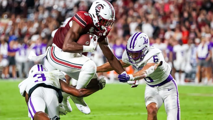 South Carolina football tight end Josh Simon hurdling a defender last season against the Furman Paladins