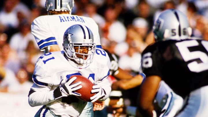 Nov 19, 1995; Oakland, CA, USA; FILE PHOTO; Dallas Cowboys defensive back Deion Sanders (21) takes a hand off from Troy Aikman (8) against Oakland Raiders defensive end Pat Swilling (56) at Oakland-Alameda County Coliseum. Mandatory Credit: Peter Brouillet-USA TODAY NETWORK