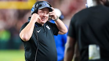 Sep 27, 2025; Columbia, South Carolina, USA; Kentucky Wildcats head coach Mark Stoops celebrates a touchdown against the South Carolina Gamecocks in the first quarter at Williams-Brice Stadium. Mandatory Credit: Jeff Blake-Imagn Images