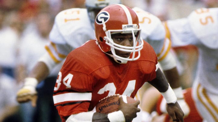 Sept 5, 1981; Athens, GA, USA; FILE PHOTO; Georgia Bulldogs running back Herschel Walker (34) carries the ball against the Tennessee Volunteers at Sanford Stadium. Sept 5, 1981; Athens, GA, USA; FILE PHOTO; Georgia Bulldogs running back Herschel Walker (34) carries the ball against the Tennessee Volunteers at Sanford Stadium.