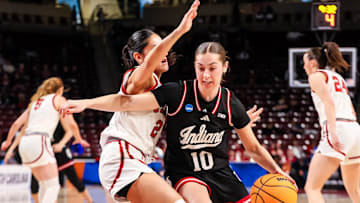 Mar 21, 2025; Columbia, South Carolina, USA; Indiana Hoosiers guard Shay Ciezki (10) drives around Utah Utes guard Ines Vieira (2) in the first half at Colonial Life Arena. Mandatory Credit: Jeff Blake-Imagn Images