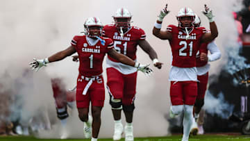 Nov 11, 2023; Columbia, South Carolina, USA; South Carolina Gamecocks defensive back DQ Smith (1), offensive lineman Tree Babalade (51), and defensive back Nick Emmanwori (21) lead their teammates onto the field before a game against the Vanderbilt Commodores at Williams-Brice Stadium. Mandatory Credit: Jeff Blake-Imagn Images