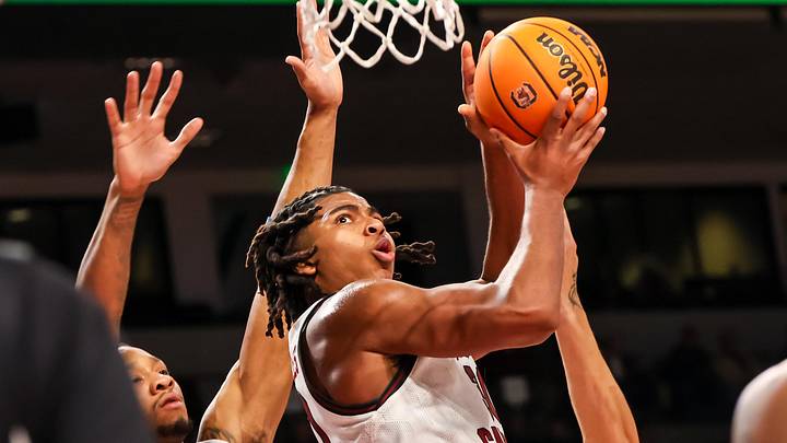 Dec 22, 2024; Columbia, South Carolina, USA; South Carolina Gamecocks forward Collin Murray-Boyles (30) drives past Radford Highlanders forward Isaiah Gaines (6) in the first half at Colonial Life Arena. Mandatory Credit: Jeff Blake-Imagn Images