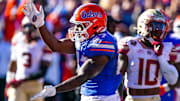 Florida running back Dameon Pierce (27) celebrates his touchdown with a gator chomp in the Gators' win over FSU in 2021.
