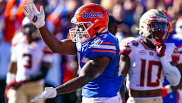 Florida running back Dameon Pierce (27) celebrates his touchdown with a gator chomp in the Gators' win over FSU in 2021.