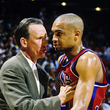 Apr 26, 1996; Orlando, FL; USA; FILE PHOTO; Detroit Pistons head coach Doug Collins talks with forward Grant Hill (33) on the sidelines against the Orlando Magic during the first round of the 1996 NBA Playoffs at the Orlando Arena. Mandatory Credit: RVR Photos-Imagn Images