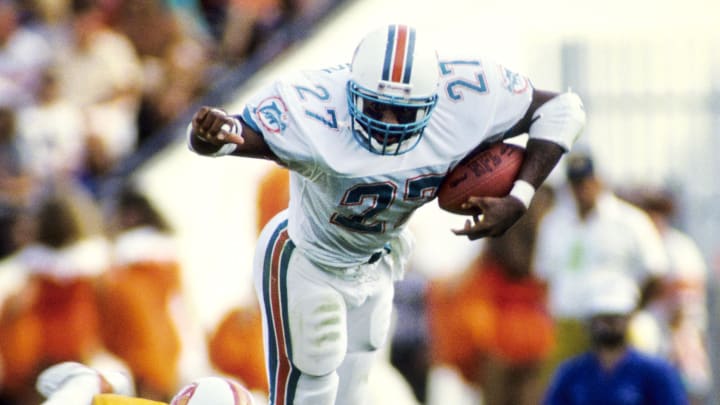 Miami Dolphins running back Lorenzo Hampton carries the ball against the Tampa Bay Buccaneers at Tampa Stadium during the 1988 season.