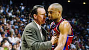 Apr 26, 1996; Orlando, FL; USA; FILE PHOTO; Detroit Pistons head coach Doug Collins talks with forward Grant Hill (33) on the sidelines against the Orlando Magic during the first round of the 1996 NBA Playoffs at the Orlando Arena. Mandatory Credit: RVR Photos-Imagn Images