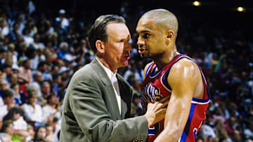 Apr 26, 1996; Orlando, FL; USA; FILE PHOTO; Detroit Pistons head coach Doug Collins talks with forward Grant Hill (33) on the sidelines against the Orlando Magic during the first round of the 1996 NBA Playoffs at the Orlando Arena. Mandatory Credit: RVR Photos-Imagn Images