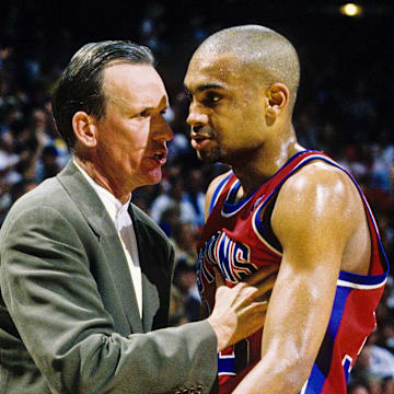 Apr 26, 1996; Orlando, FL; USA; FILE PHOTO; Detroit Pistons head coach Doug Collins talks with forward Grant Hill (33) on the sidelines against the Orlando Magic during the first round of the 1996 NBA Playoffs at the Orlando Arena. Mandatory Credit: RVR Photos-Imagn Images