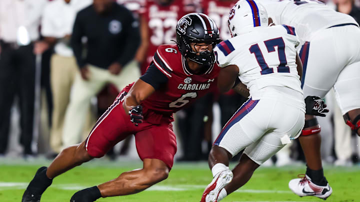 Sep 6, 2025; Columbia, South Carolina, USA; South Carolina Gamecocks linebacker Dylan Stewart (6) brings down South Carolina State Bulldogs running back KZ Adams (17) in the first quarter at Williams-Brice Stadium. Mandatory Credit: Jeff Blake-Imagn Images