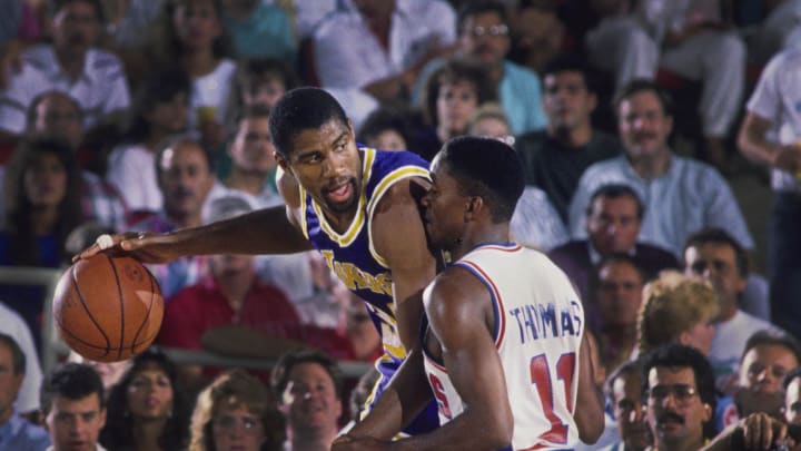 Unknown date; Detroit, MI, USA; FILE PHOTO; Los Angeles Lakers guard Magic Johnson (32) is defended by Detroit Pistons guard Isiah Thomas (11) at the Silverdome. Mandatory Credit: MPS-USA TODAY Sports