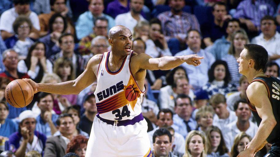 Phoenix Suns forward Charles Barkley is defended by Seattle Supersonics forward Detlef Schrempf.