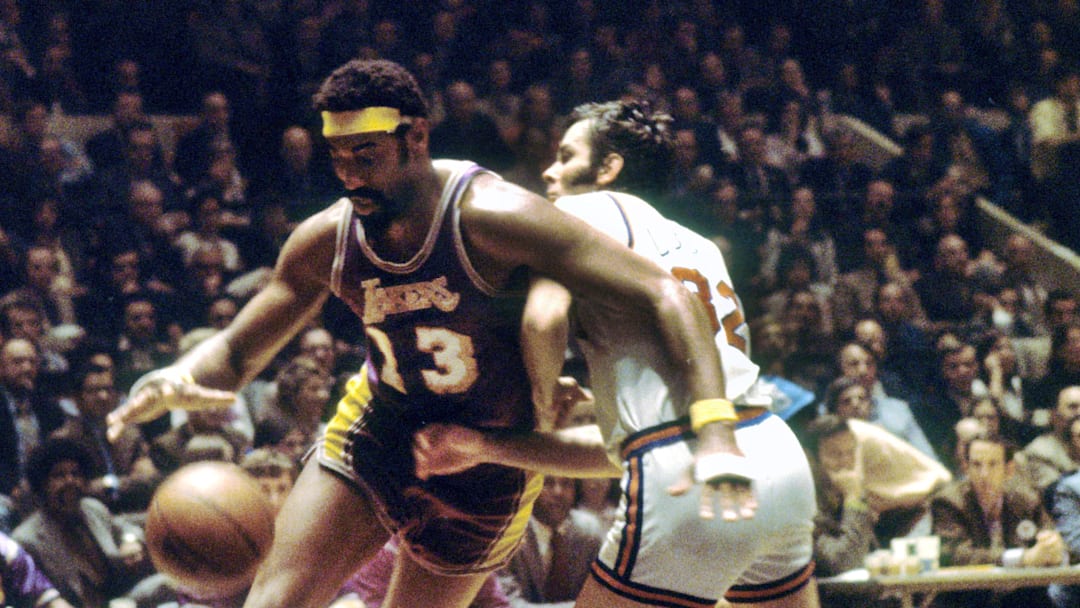Jan 1, 1975; New York, NY, USA; FILE PHOTO; Los Angeles Lakers center Wilt Chamberlain (13) drives the baseline as New York Knicks forward Jerry Lucas (32) defends at Madison Square Garden. Mandatory Credit: Dick Raphael-Imagn Images