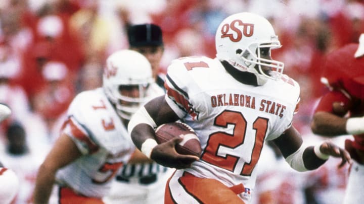 Oct 15, 1988; Lincoln, NE, USA; FILE PHOTO; Oklahoma State Cowboys running back Barry Sanders (21) carries the ball against the Nebraska Cornhuskers at Memorial Stadium.  Mandatory Credit: Malcolm Emmons-USA TODAY Sports