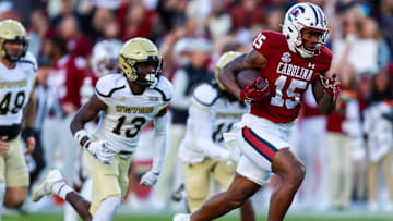 Nov 23, 2024; Columbia, South Carolina, USA; South Carolina Gamecocks wide receiver Dalevon Campbell (15) runs after a catch against Wofford Terriers defensive back Amir Annoor (13) in the first quarter at Williams-Brice Stadium. Mandatory Credit: Jeff Blake-Imagn Images