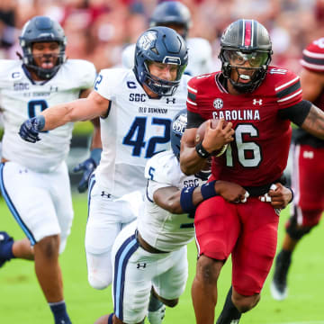 Aug 31, 2024; Columbia, South Carolina, USA; South Carolina Gamecocks quarterback LaNorris Sellers (16) is tackled by Old Dominion Monarchs safety Jahron Manning (5) in the first quarter at Williams-Brice Stadium. Mandatory Credit: Jeff Blake-USA TODAY Sports