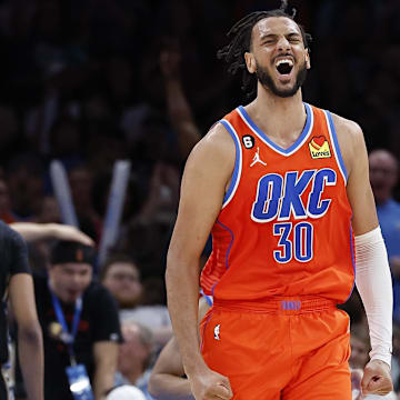 Apr 9, 2023; Oklahoma City, Oklahoma, USA;  Oklahoma City Thunder center Olivier Sarr (30) celebrates during the second half against the Memphis Grizzlies at Paycom Center. Oklahoma City won 115-100. Mandatory Credit: Alonzo Adams-Imagn Images
