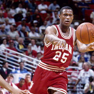 Indiana Hoosiers guard A.J. Guyton (25) in action against St. John's Red Storm guard Collin Charles during the second round of the NCAA tournament at the Orlando Arena. St. John's defeated Indiana 86-61.
