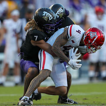 Channing Canada prevents Tetairoa McMillan from getting a first down after a completed pass. 