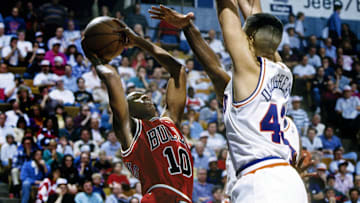 Unknown date 1993; Richfield, OH, USA; FILE PHOTO; Chicago Bulls guard B.J. Armstrong (10) is guarded by Cleveland Cavaliers center Brad Daugherty (43) at the Richfield Coliseum. Mandatory Credit: Imagn Images