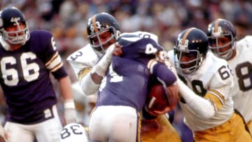 Jan 12, 1975; New Orleans, LA, USA; FILE PHOTO; Pittsburgh Steelers defensive tackle (63) Ernie Holmes and (68) L.C. Greenwood stop Minnesota Vikings running back (41) Dave Osborn during Super Bowl IX at Tulane Stadium.  The Steelers defeated the Vikings 16-6 and earn their first Super Bowl Title. Mandatory Credit: Tony Tomsic-USA TODAY NETWORK