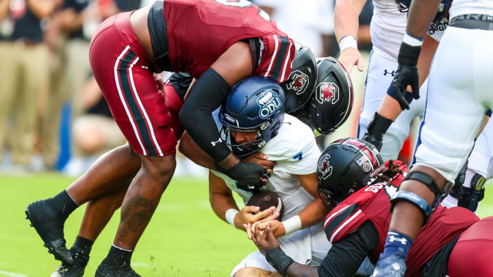 Aug 31, 2024; Columbia, South Carolina, USA; Old Dominion Monarchs quarterback Grant Wilson (7) is sacked by South Carolina Gamecocks edge Dylan Stewart (6) and edge Kyle Kennard (5) in the second quarter at Williams-Brice Stadium. Mandatory Credit: Jeff Blake-USA TODAY Sports