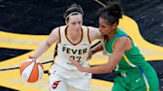 Indiana Fever guard Caitlin Clark (22) brings the ball up court as BrazilÕs Carina Dos Santos Martins (17) defends during an WNBA game May 4, 2025 at Carver-Hawkeye Arena in Iowa City, Iowa.