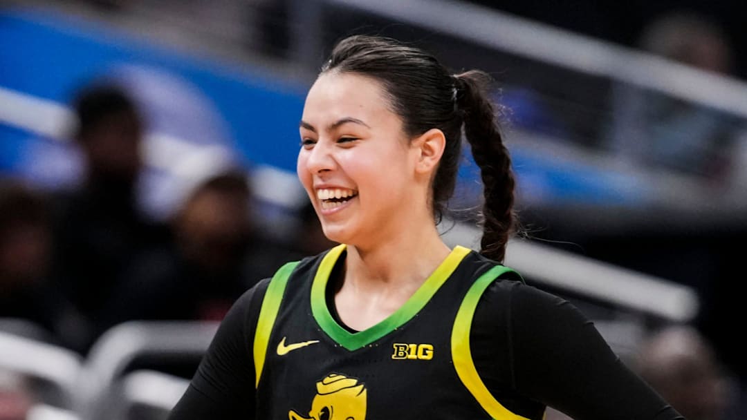 Oregon Ducks guard Ari Long (14) smiles while running to the bench Thursday, March 5, 2026, during a Big Ten women's basketball tournament game at Gainbridge Fieldhouse in Indianapolis. The Oregon Ducks defeated the Maryland Terrapins, 73-68. Oregon Ducks guard Ari Long (14) smiles while running to the bench Thursday, March 5, 2026, during a Big Ten women's basketball tournament game at Gainbridge Fieldhouse in Indianapolis. The Oregon Ducks defeated the Maryland Terrapins, 73-68.