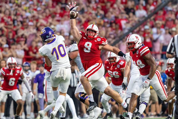 Nebraska defensive lineman Ty Robinson bats down a pass from Northern Iowa quarterback Aidan Dunne.