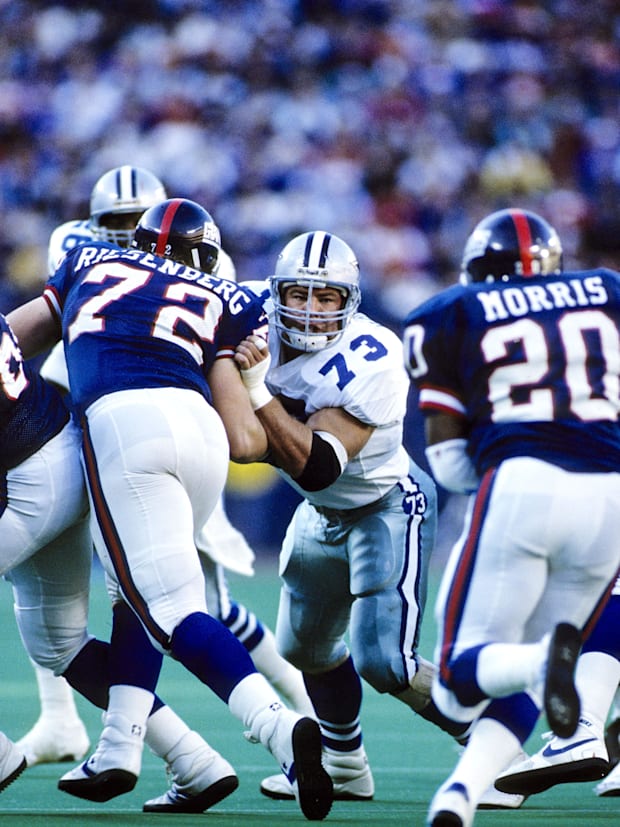 Dallas Cowboys defensive tackle Danny Noonan (73) in action against New York Giants offensive players Joe Morris (20).