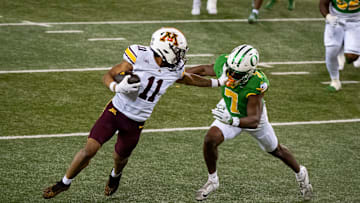 Minnesota wide receiver Javon Tracy, left, outruns Oregon defensive back Ify Obidegwu on his way to a touchdown as the Oregon Ducks host the Minnesota Golden Gophers on Nov. 14, 2025, at Autzen Stadium in Eugene, Oregon.