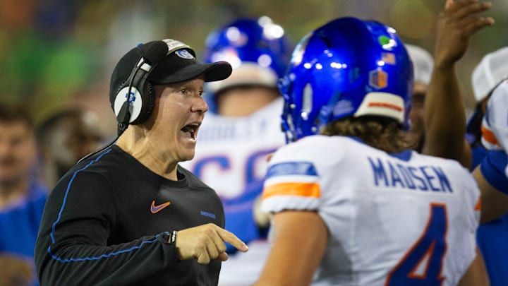 Boise State coach Spencer Danielson, left, celebrates with quarterback Maddux Madsen after a second quarter touchdown against Oregon at Autzen Stadium in Eugene Sept. 7, 2024.