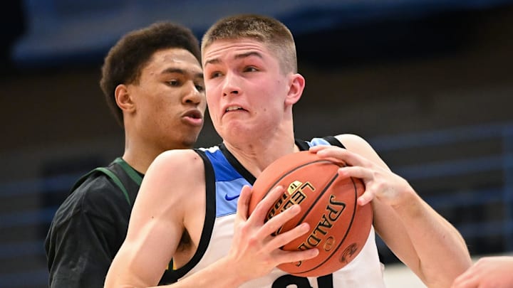 Brookfield Central forward Henry Gruetzmacher (31) goes to the hoop past Freedom forward Donovan Davis (24) in the Rick Majerus WBY Shootout on Saturday, December 27, 2025.