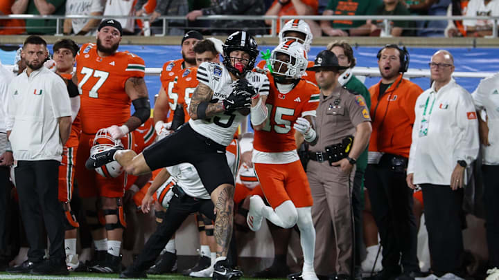 Iowa State Cyclones wide receiver Jaylin Noel runs with Miami Hurricanes star Markeith Williams during the Pop Tarts bowl Iowa State Cyclones wide receiver Jaylin Noel runs with Miami Hurricanes star Markeith Williams during the Pop Tarts bowl