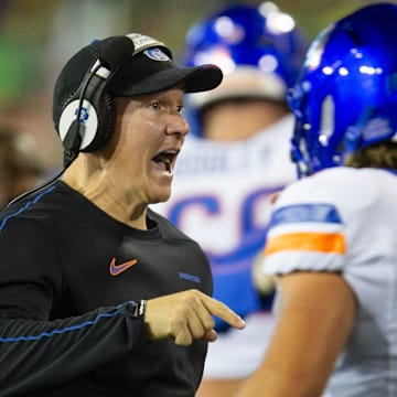 Boise State coach Spencer Danielson, left, celebrates with quarterback Maddux Madsen after a second quarter touchdown against Oregon at Autzen Stadium in Eugene Sept. 7, 2024.