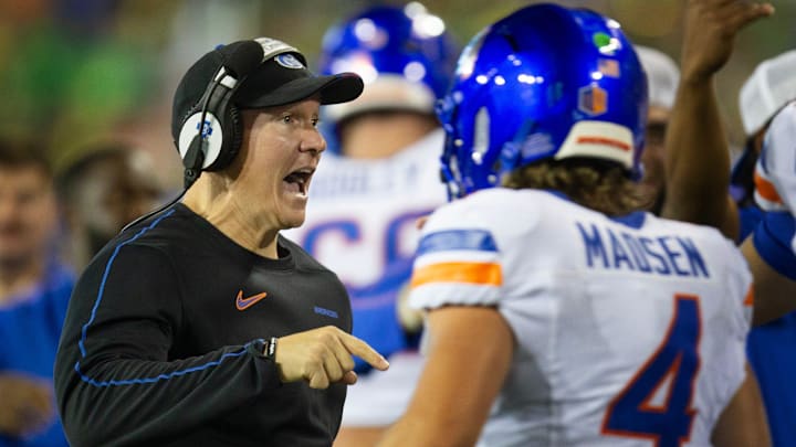 Boise State coach Spencer Danielson, left, celebrates with quarterback Maddux Madsen after a second quarter touchdown against Oregon at Autzen Stadium in Eugene Sept. 7, 2024.