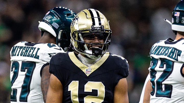 Sep 22, 2024; New Orleans, Louisiana, USA; New Orleans Saints wide receiver Chris Olave (12) reacts to making a first down reception against Philadelphia Eagles safety Reed Blankenship (32) during the first half at Caesars Superdome. Mandatory Credit: Stephen Lew-Imagn Images Sep 22, 2024; New Orleans, Louisiana, USA; New Orleans Saints wide receiver Chris Olave (12) reacts to making a first down reception against Philadelphia Eagles safety Reed Blankenship (32) during the first half at Caesars Superdome. Mandatory Credit: Stephen Lew-Imagn Images