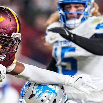Detroit Lions cornerback Arthur Maulet (27) tackles Washington Commanders kick returner Noah Igbinoghene (6) during the second half at Northwest Stadium in Landover, Md. on Sunday, November 9, 2025.