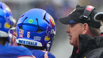 Oct 25, 2025; Lawrence, Kansas, USA; Kansas Jayhawks head coach Lance Leipold talks with quarterback Jalon Daniels (6) after he scores a touchdown against the Kansas State Wildcats during the first half of the game at David Booth Kansas Memorial Stadium. Mandatory Credit: Denny Medley-Imagn Images